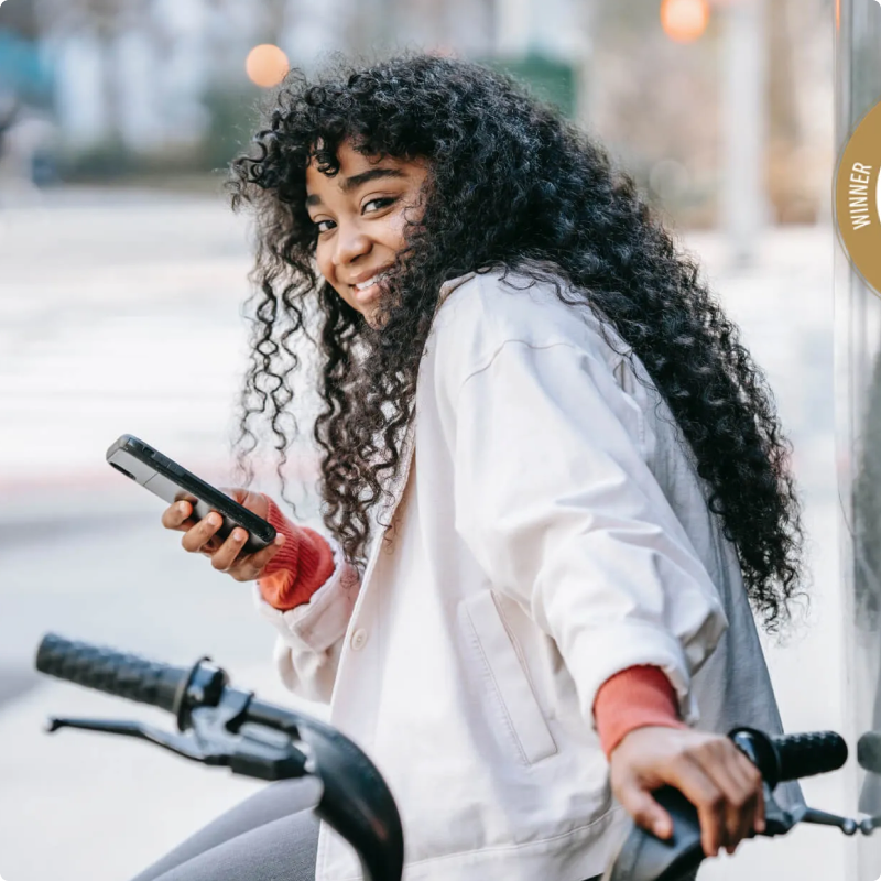 blurry photo of sunset over ocean with logo on top